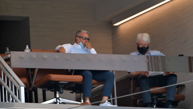 Jul 7, 2020; Kansas City, Missouri, United States; Kansas City Royals general manager Dayton Moore (left) and principle owner John Sherman watch during an intrasquad game at Kauffman Stadium. Mandatory Credit: Denny Medley-USA TODAY Sports